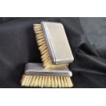 Pair of silver backed brushes CP971