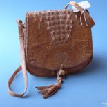 A crocodile skin ladies handbag with tan