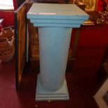 A blue painted column form plinth