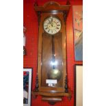 A satin walnut regulator wall clock with