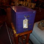 A pine stool together with purple painte