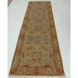 A Ziegler Kelleh rug, the central palmette design on a camel ground within complimentary