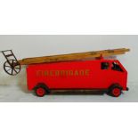 A vintage painted toy fire engine by Tur Mix