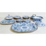 An extensive blue and white part ironstone dinner service, to include meat plates, tureens, etc (