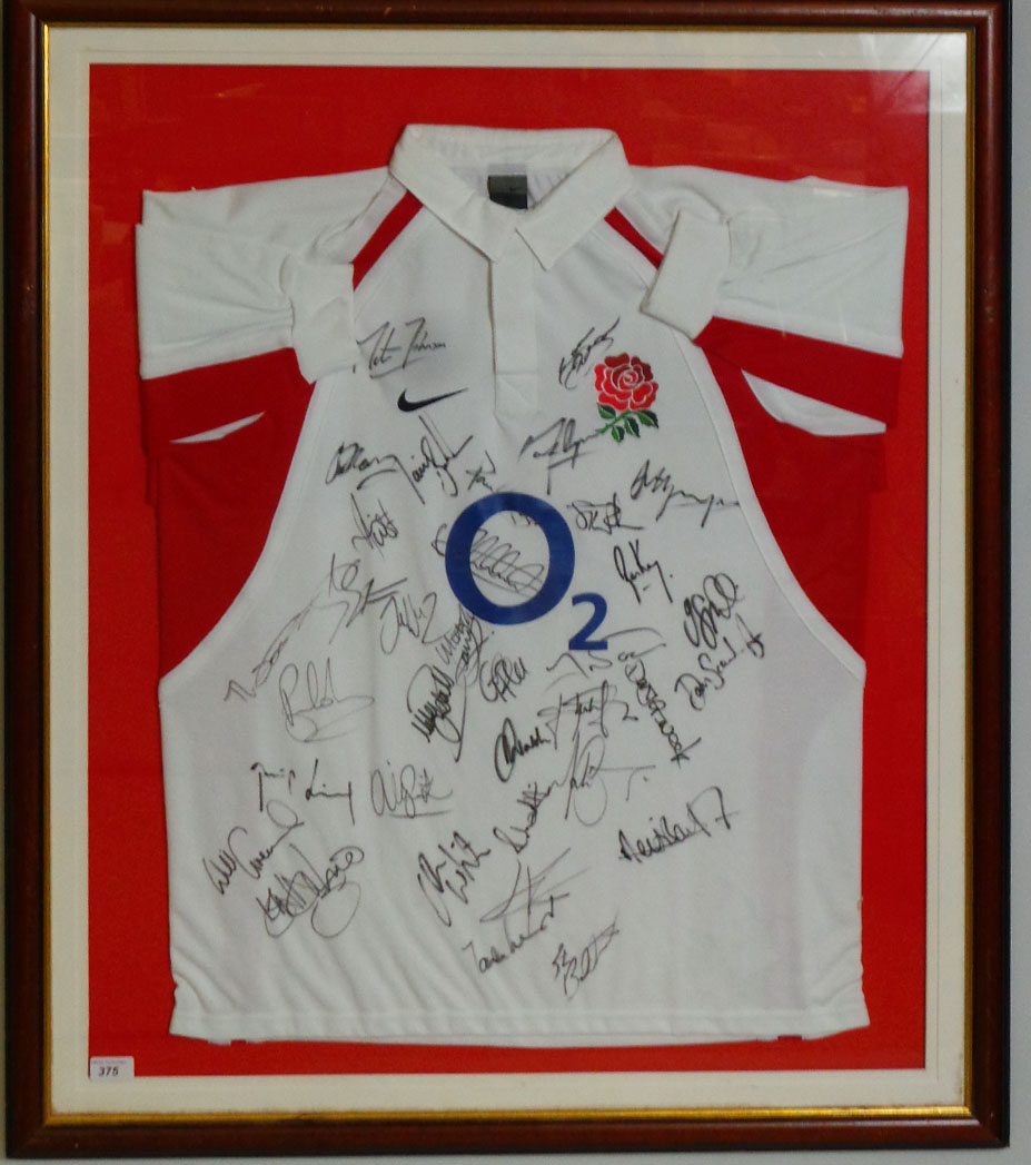 A framed and glazed 2005 England rugby shirt, bearing signatures of the players, 106cm x 88cm