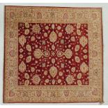 A fine Farahan design rug, the central vine and palmette design on an abrashed scarlet ground within