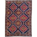 A Persian Yalameh rug, the all over autumnal medallion design on a midnight blue ground within
