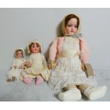 A large Armand Marseilles doll and two smaller Armand Marseille dolls