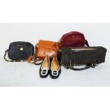 A collection of designer handbags and a pair of Hermes shoes