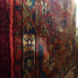 A fine north west Persian Nahawand carpet 242cm x 152cm central jade pole medallion on a rouge