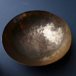 An Indo-Persian planished white metal bowl with engraved detail,