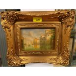 A pair of oils on board depicting Venetian scenes in gilded frames