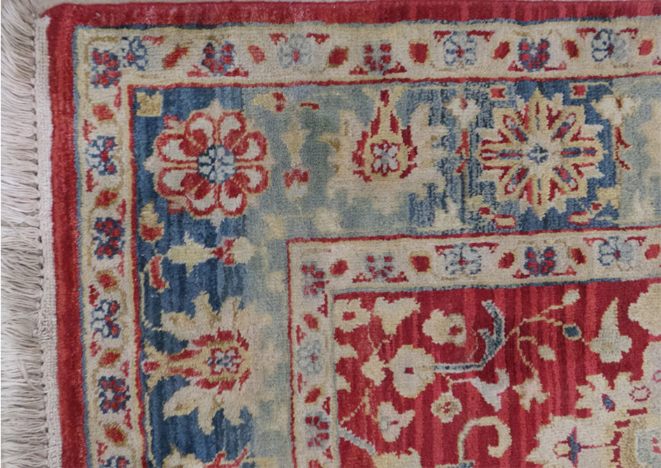 An Indian Agra carpet, the all over vine and palmette design on an abrashed terracotta ground within - Image 2 of 2