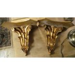 A pair of Rococo design giltwood wall brackets with foliate decoration (2)