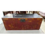 An Oriental red and black lacquered camphorwood trunk with figural decoration