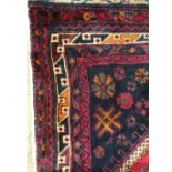 A fine South West Persian lori rug, 327cm x 157cm, double pole medallion with repeating animal
