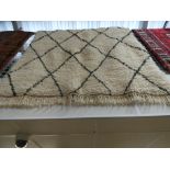 A vintage Moroccan Berber (Beni Ourain) rug, the all over geometric lozenge design on a thick