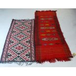 A Turkish kilim runner, having an all over geometric design on a scarlet ground, with another