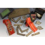 A BOX OF MILITARY COLLECTABLES, to include a side cap, various cloth badges, a tin of cuff links etc