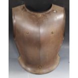 A CROMWELLIAN STYLE FRONT BREAST PLATE, with front central crease and brass stud decoration, H 40 cm