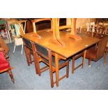 A TEAK EXTENDING DINING TABLE + FOUR CHAIRS