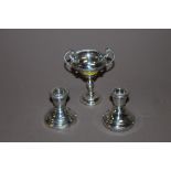 A PAIR OF SMALL BIRMINGHAM HALLMARKED SILVER CANDLESTICKS TOGETHER WITH A BIRMINGHAM SILVER