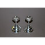 A PAIR OF BIRMINGHAM HALLMARKED SILVER DWARF CANDLESTICK HOLDERS