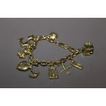 A 9CT GOLD CHARM BRACELET WITH CHARMS, APPROX WEIGHT 4.28g