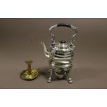 A SILVER PLATED SPIRIT KETTLE ON STAND WITH BURNER + BRASS CANDLESTICK HOLDER