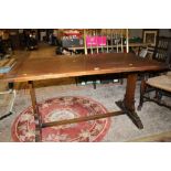 AN OAK REFECTORY STYLE DINING TABLE