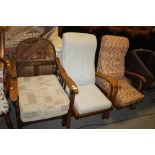 A 1920S OAK BERGERE ARMCHAIR & TWO MORE ARMCHAIRS (3)