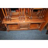 AN OAK LINENFOLD COFFEE TABLE WITH CUPBOARD BELOW A/F