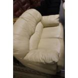 A CREAM TWO SEATER SETTEE