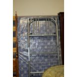 A METAL SINGLE BED FRAMED & A LARGER MATTRESS