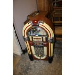 A MODERN CD / RADIO IN THE FORM OF A JUKEBOX & REMOTE