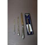 FOUR ASSORTED SILVER HANDLED KNIVES