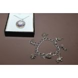 A SILVER CHARM BRACELET + PENDANT & CHAIN