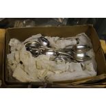 A QUANTITY OF SILVER PLATED SPOONS + A PAIR OF SUGAR TONGS