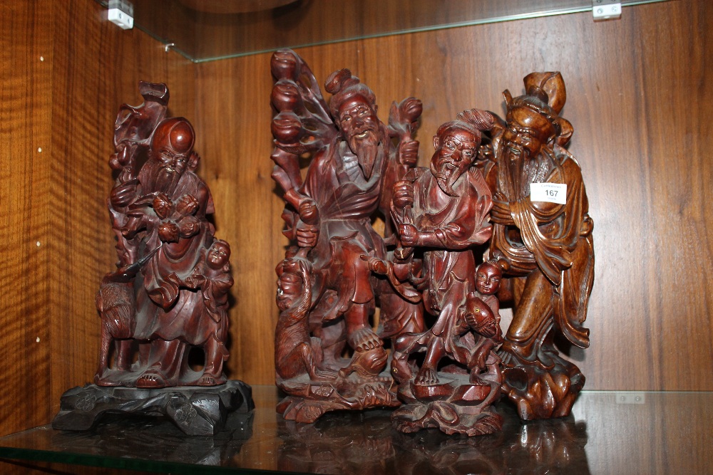 FOUR CARVED WOODEN TRADITIONAL CHINESE STYLE FIGURES