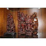 FOUR CARVED WOODEN TRADITIONAL CHINESE STYLE FIGURES