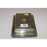 A WHITE METAL LIDDED BOX ON PRESENTATION TRAY STAMPED WITH ORIENTAL SYMBOLS