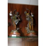 A PAIR OF SPELTER STYLE FIGURES ON PLINTHS