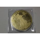 A LARGE GOLD PLATED 20 DOLLAR COIN IN CASE