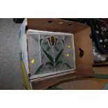 A BOX OF STAINED GLASS WINDOWS