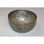 A WHITE METAL BOWL WITH SUB CONTINENTAL DECORATION STAMPED TO BASE