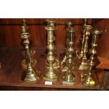 A QUANTITY OF BRASS CANDLE STICKS