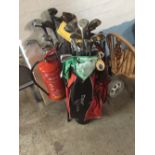 A QUANTITY OF GOLF CLUBS CONTAINED IN TWO TROLLYS & LOOSE