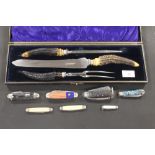 A CASED CARVING SET TOGETHER WITH A SELECTION OF POCKET KNIVES