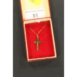 A YELLOW METAL CRUCIFIX