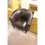 A LEATHER TUB CHAIR